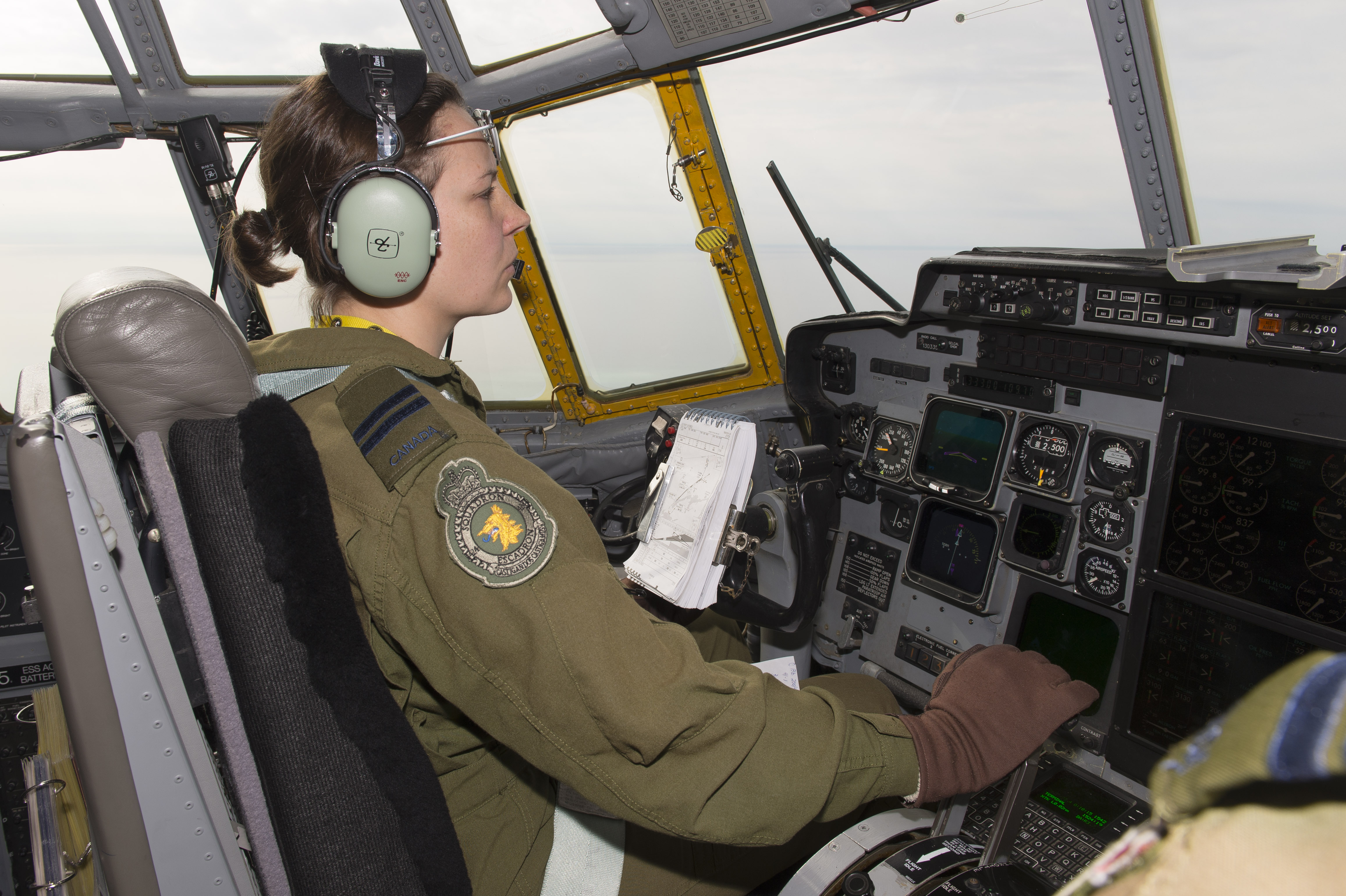 Captain Marie-Hélène Marseille, a pilot with 424 Squadron, adjusts her aircraft’s speed during a search and rescue exercise on February 28, 2018, while flying over Hamilton, Ontario. PHOTO: Ordinary Seaman Paul Green