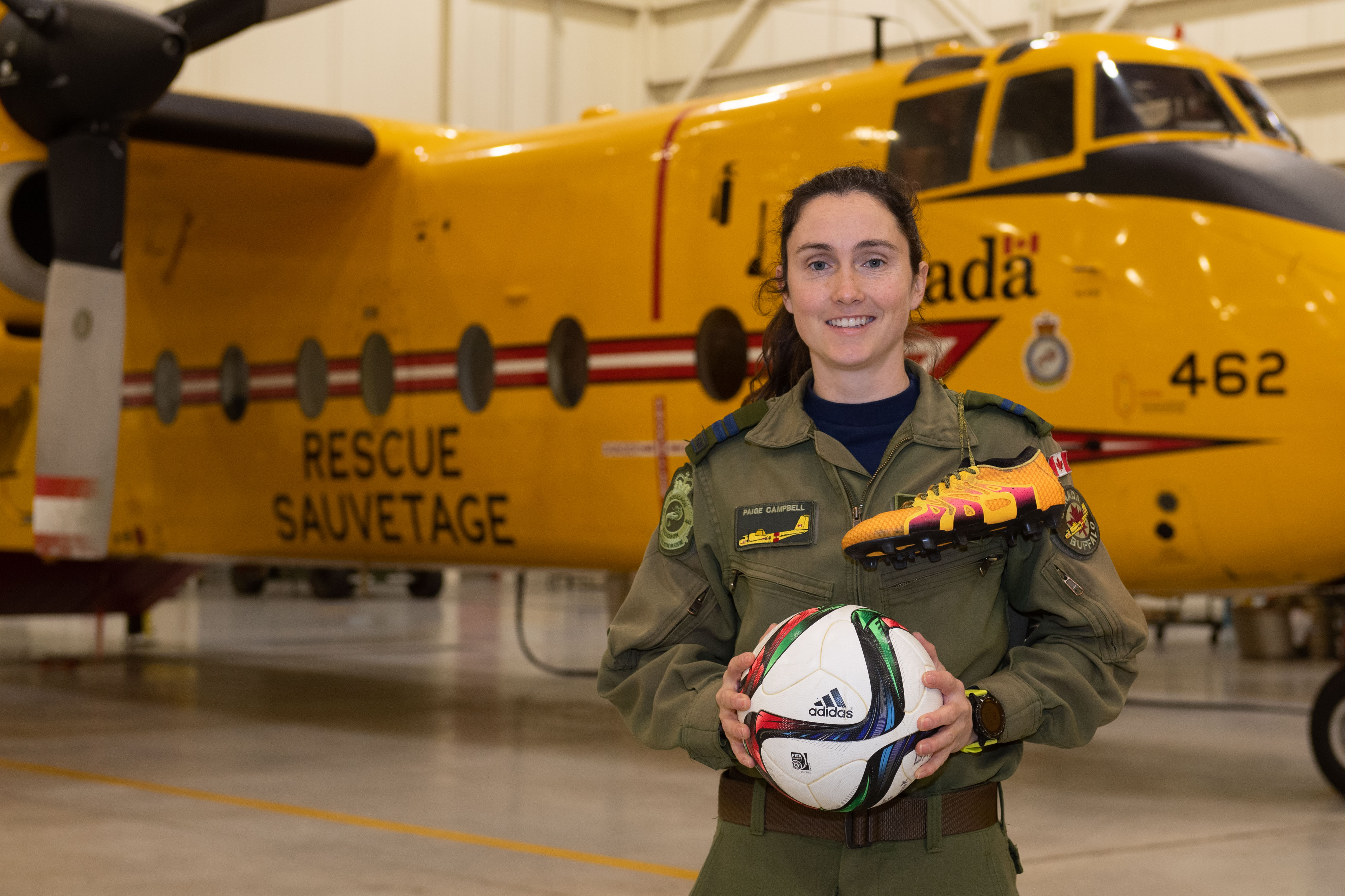 RCAF Female Athlete of the Year, Captain Paige Campbell, an Air Combat Systems Officer with 442 Transport and Rescue Squadron, at 19 Wing Comox, poses in front of a CC-115 Buffalo search and rescue aircraft at 19 Wing Comox, British Columbia, on December 3, 2020. PHOTO: Corporal Joey Beaudin